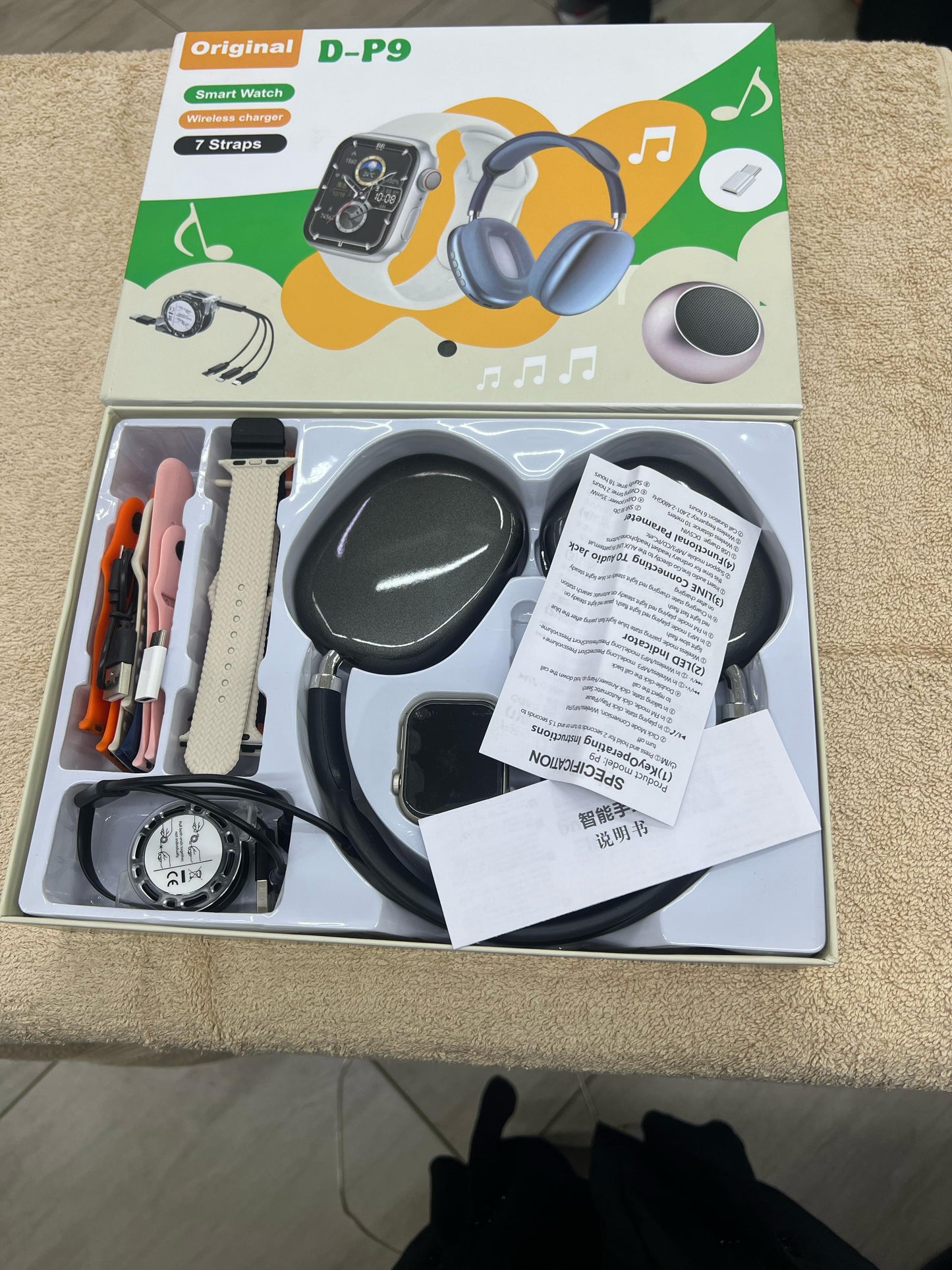 D-P9 Smartwatch with Wireless Charger, Bluetooth Headphones, and 7 Straps
